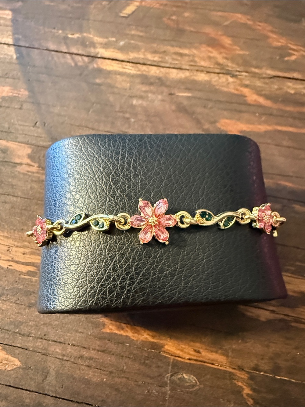 Pink Flower Gold-Tone Bracelet with Green Accent